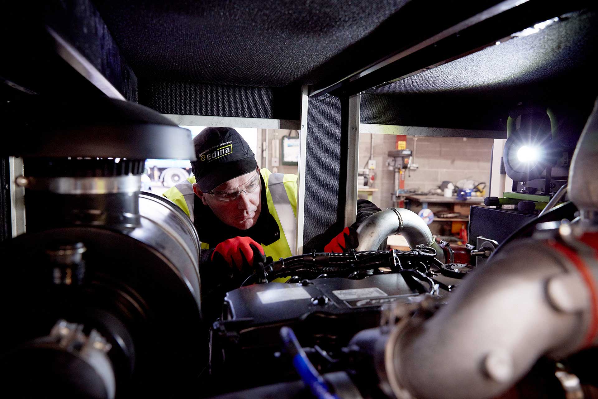 Edina Engineer performing maintenance on a diesel generator