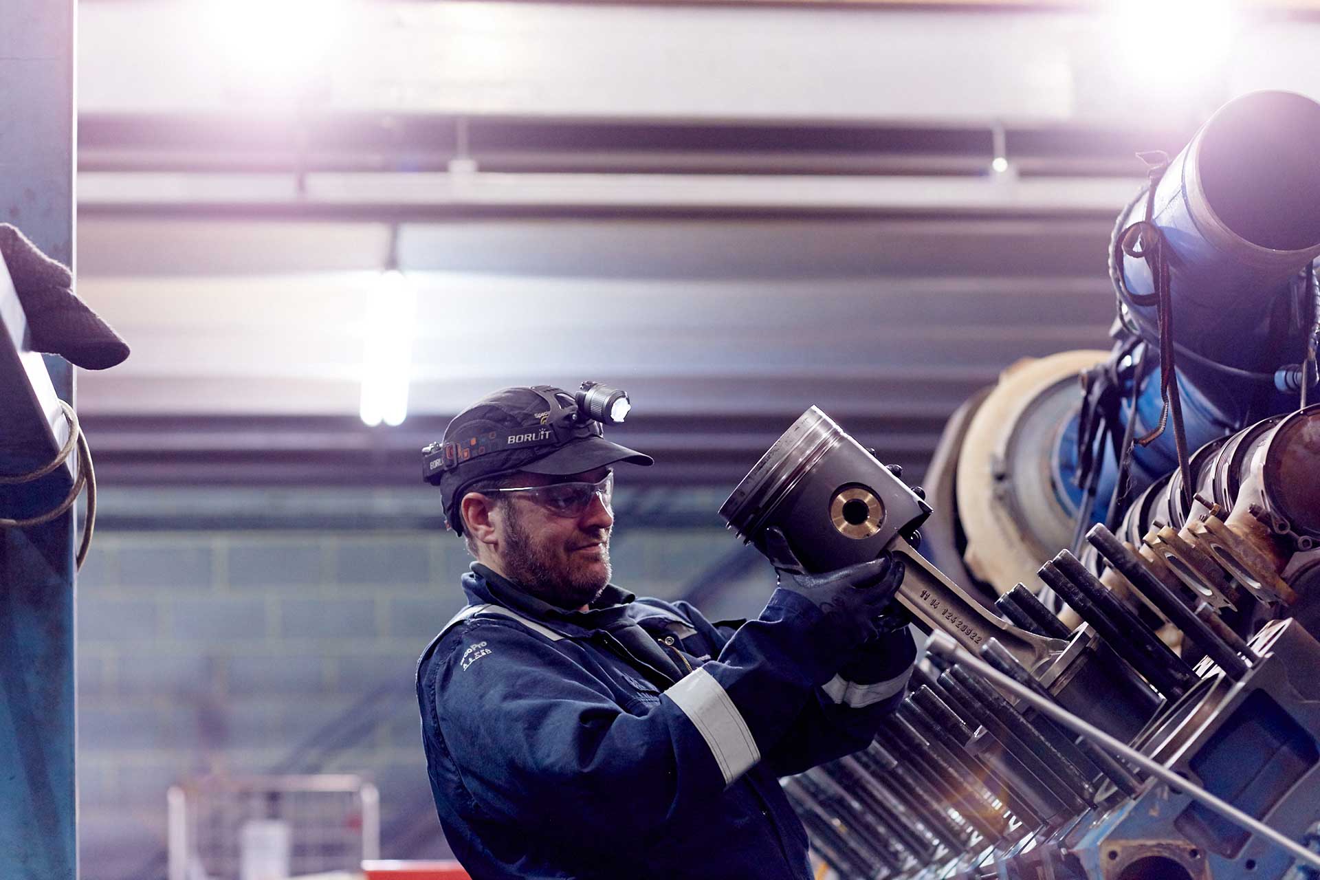 Edina Engineer performing Maintenance on a Gas Engine